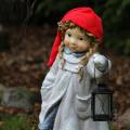 Świąteczna Dziewczynka w czerwonej czapce 55cm